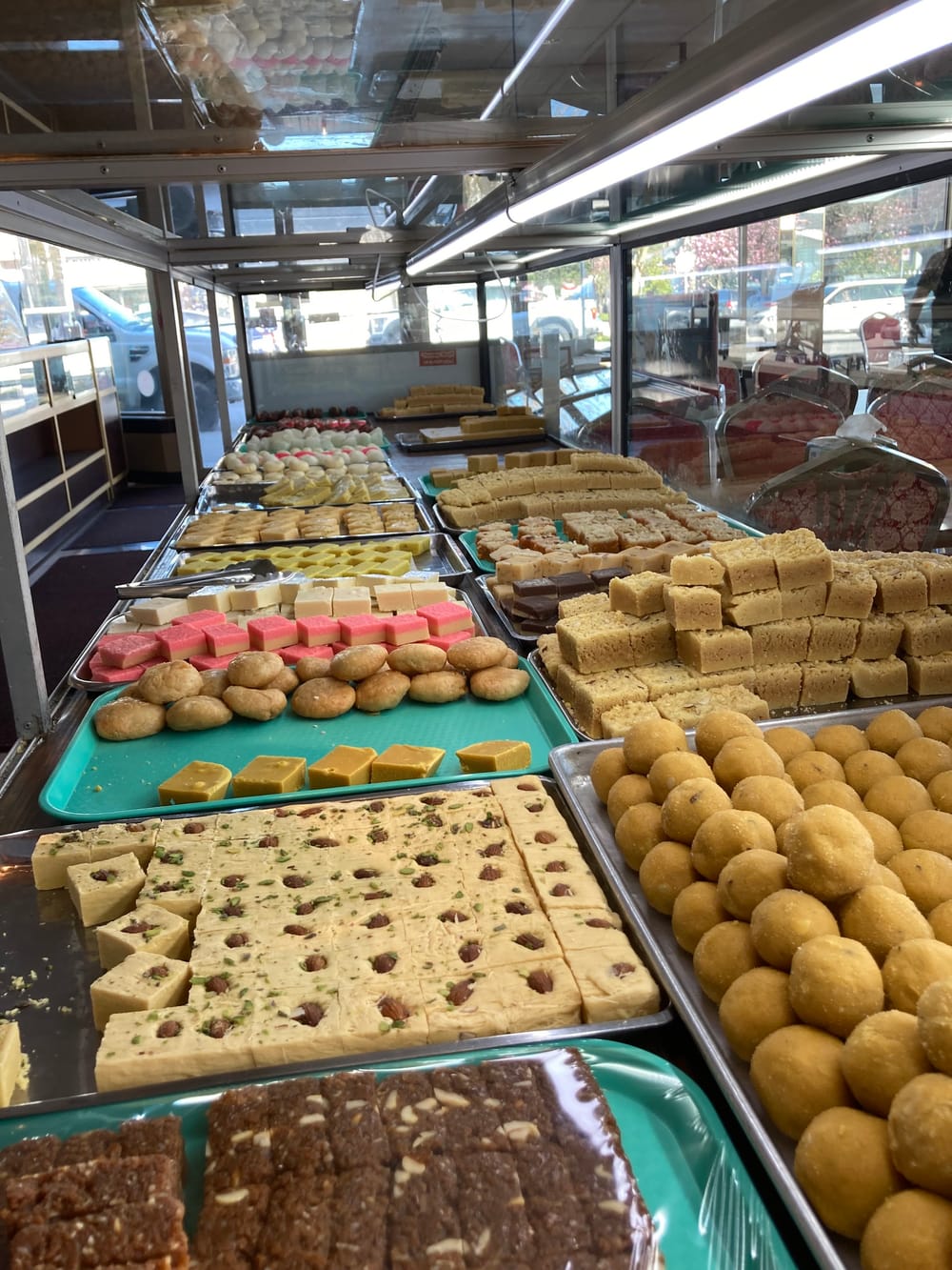 Trays of barfi and ladoo at the Himalaya sweets counter